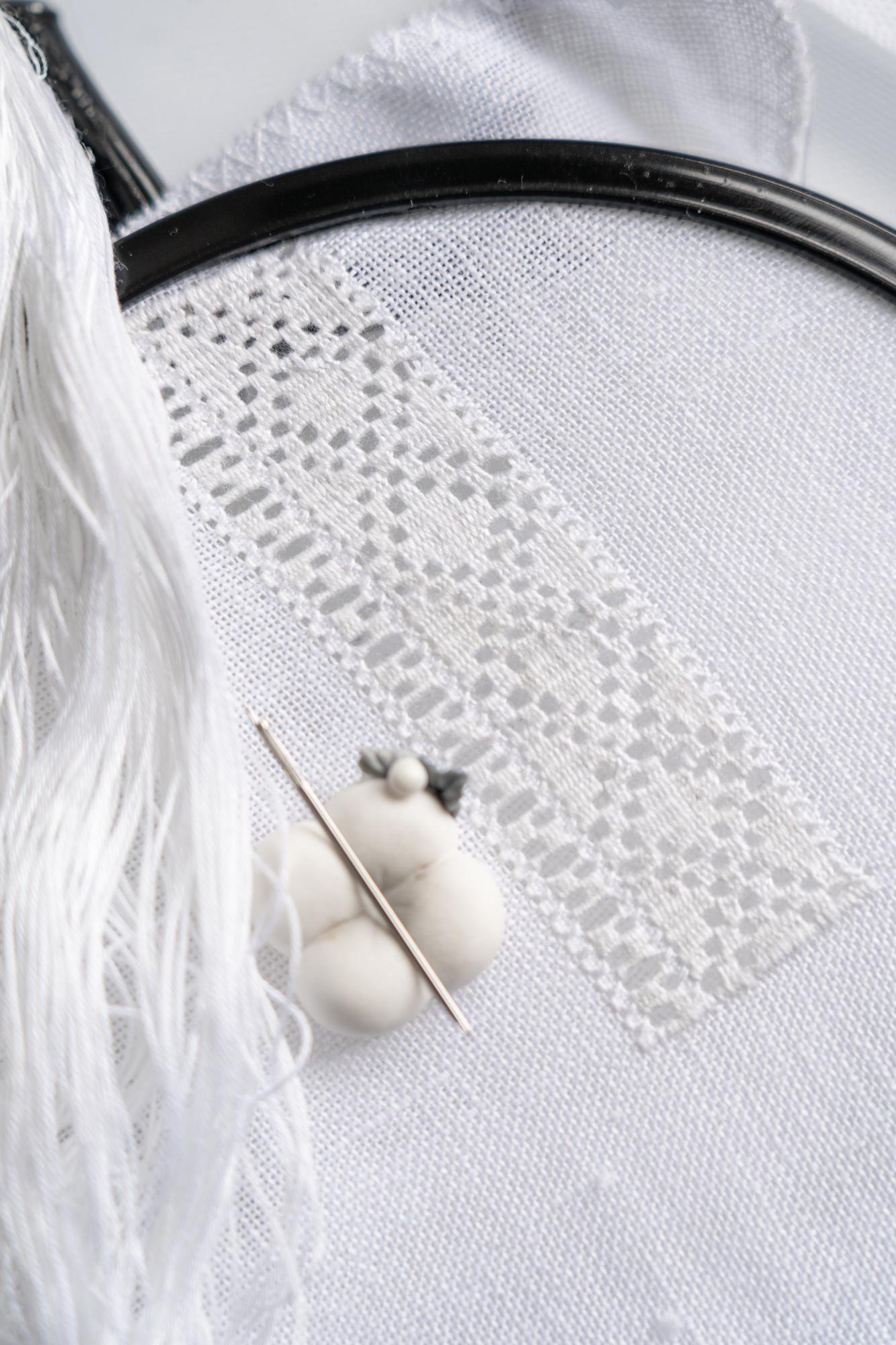 detailed satin-stitch monogram on linen