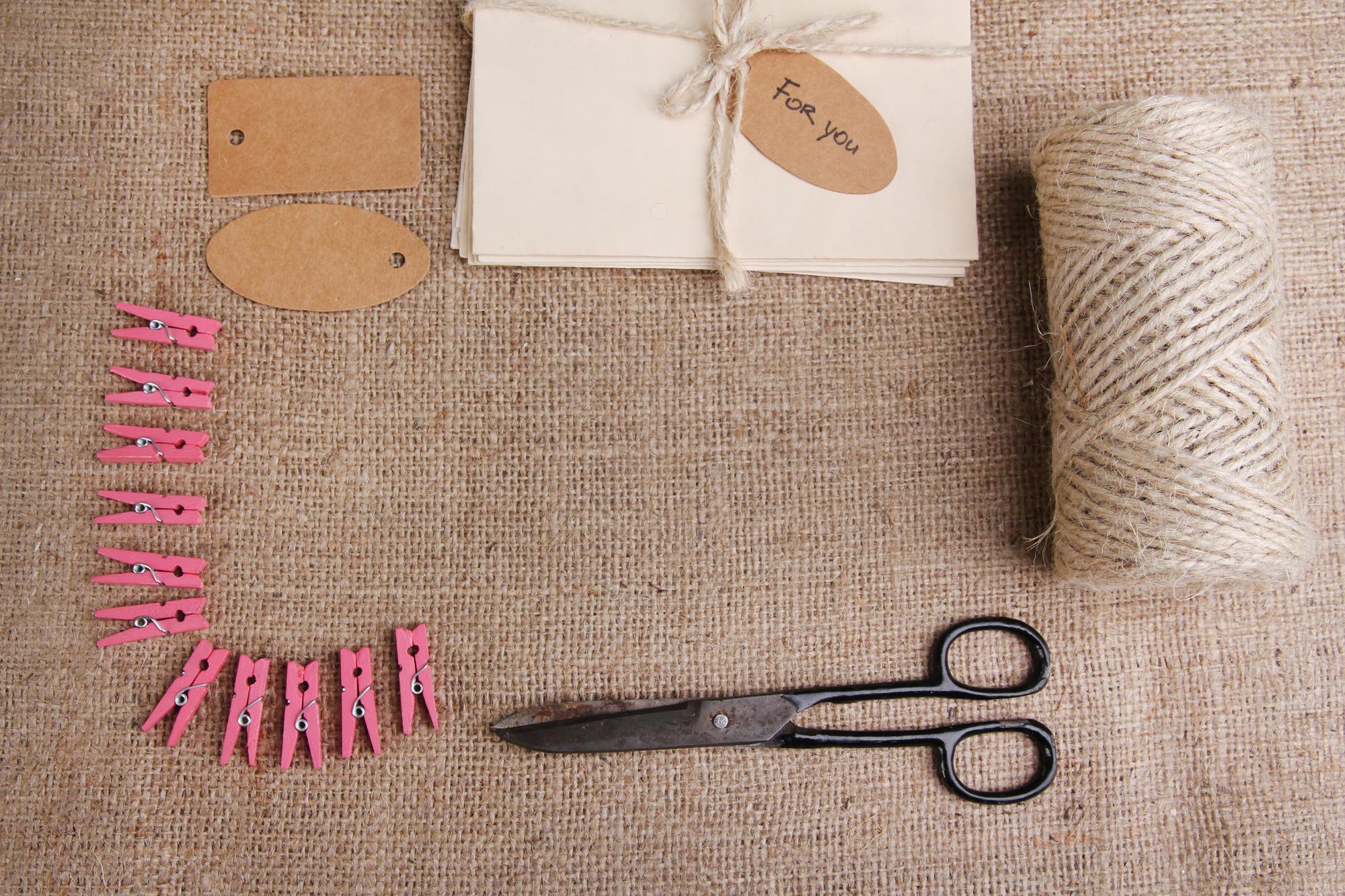 series of embroidered labels on kraft paper